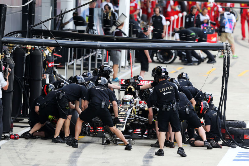 Romain Grosjean (FRA) Lotus F1 E23 practices a pit stop. British Grand Prix, Saturday 4th July 2015. Silverstone, England.